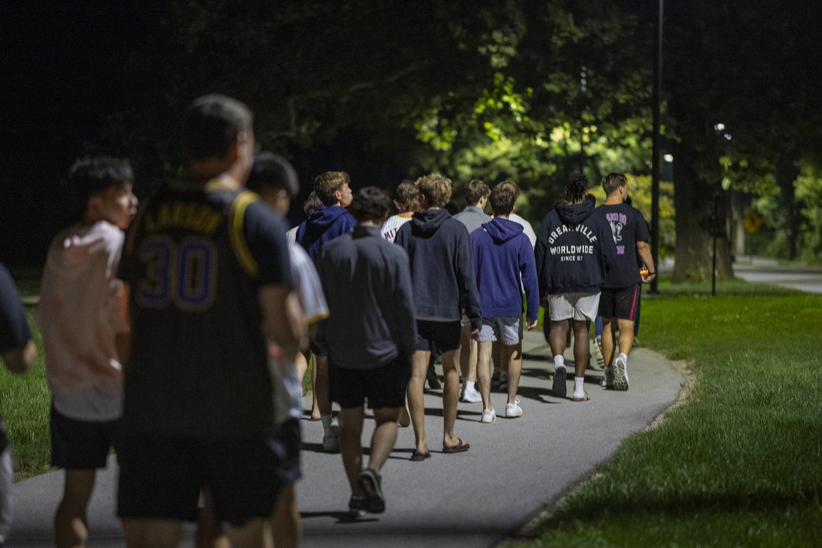 Royals walking campus together at night